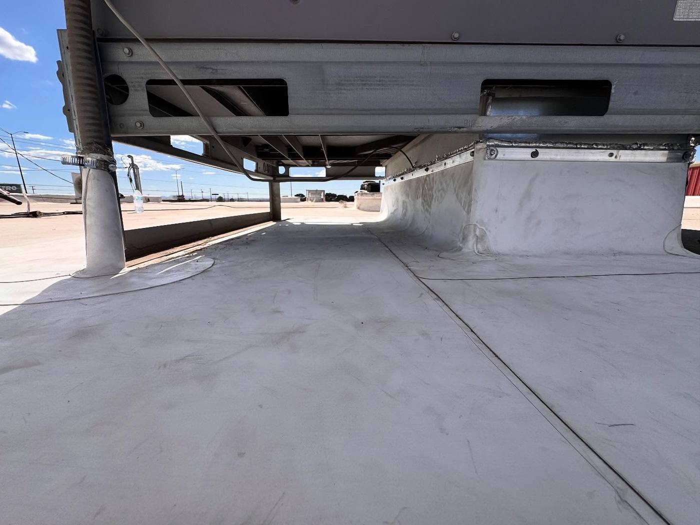 Coated flat roof deck under an overhang in El Paso