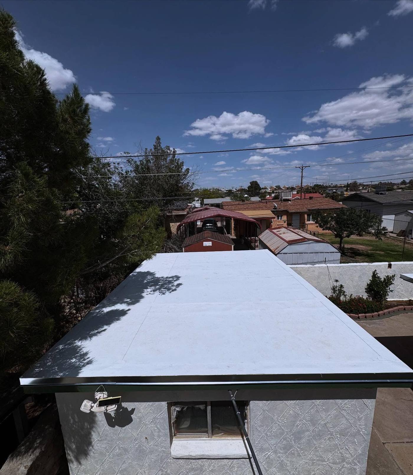 White coated flat roof on a home in El Paso, TX
